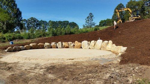 Yellow Excavator and Man — Earthmoving Services  in Eungai Creek, NSW