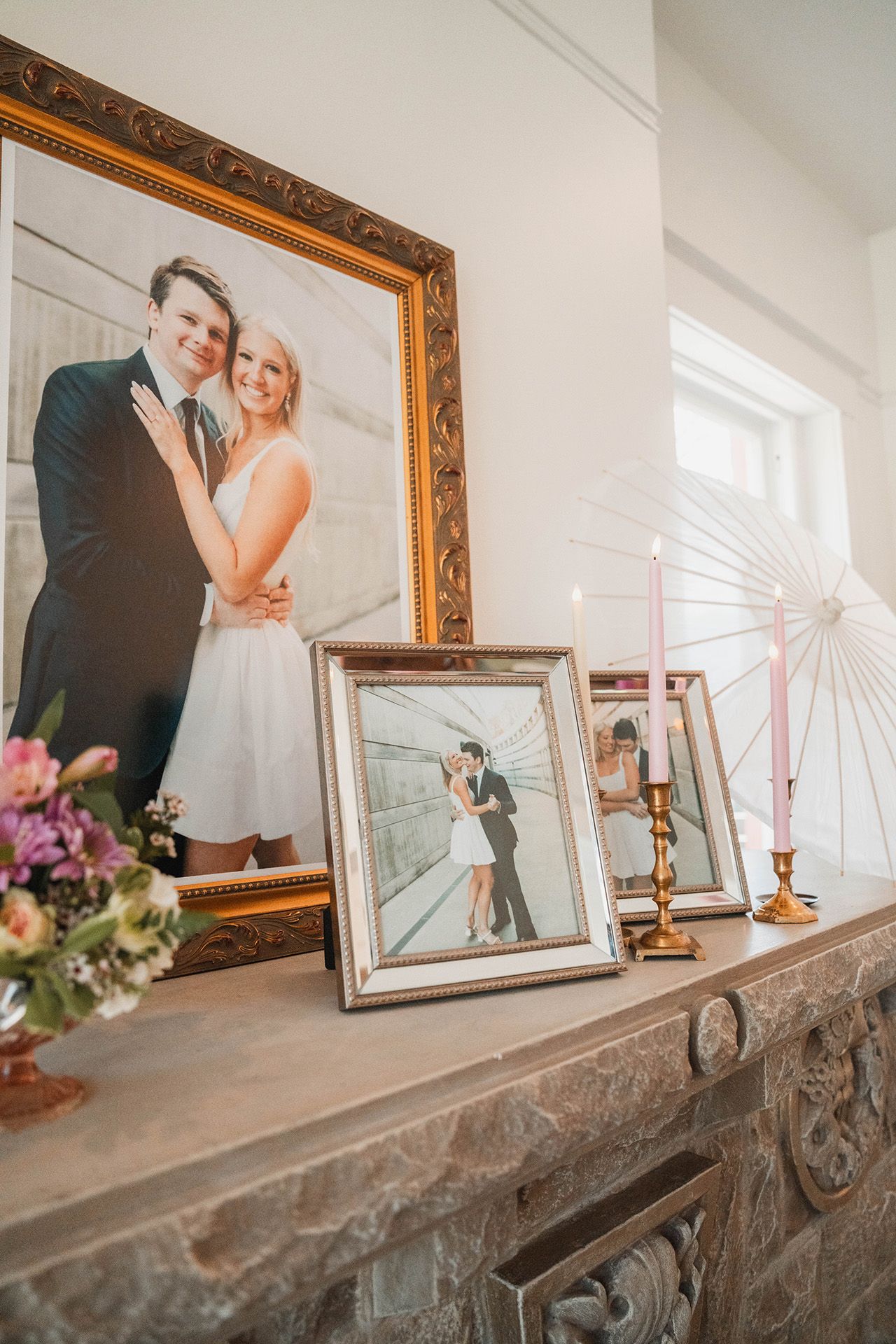 A mantle with a picture of a bride and groom on it.