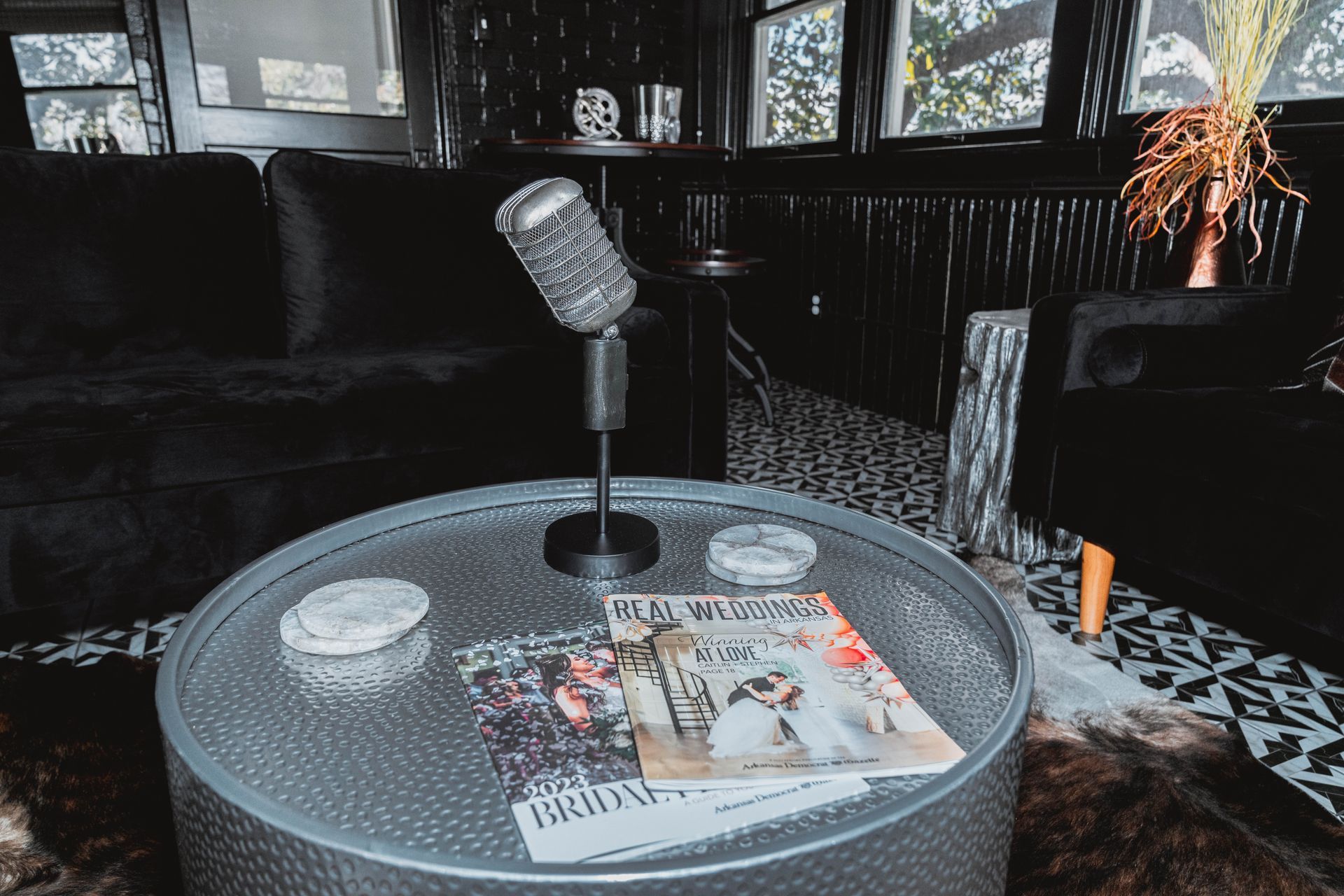 A round coffee table with a microphone on top of it