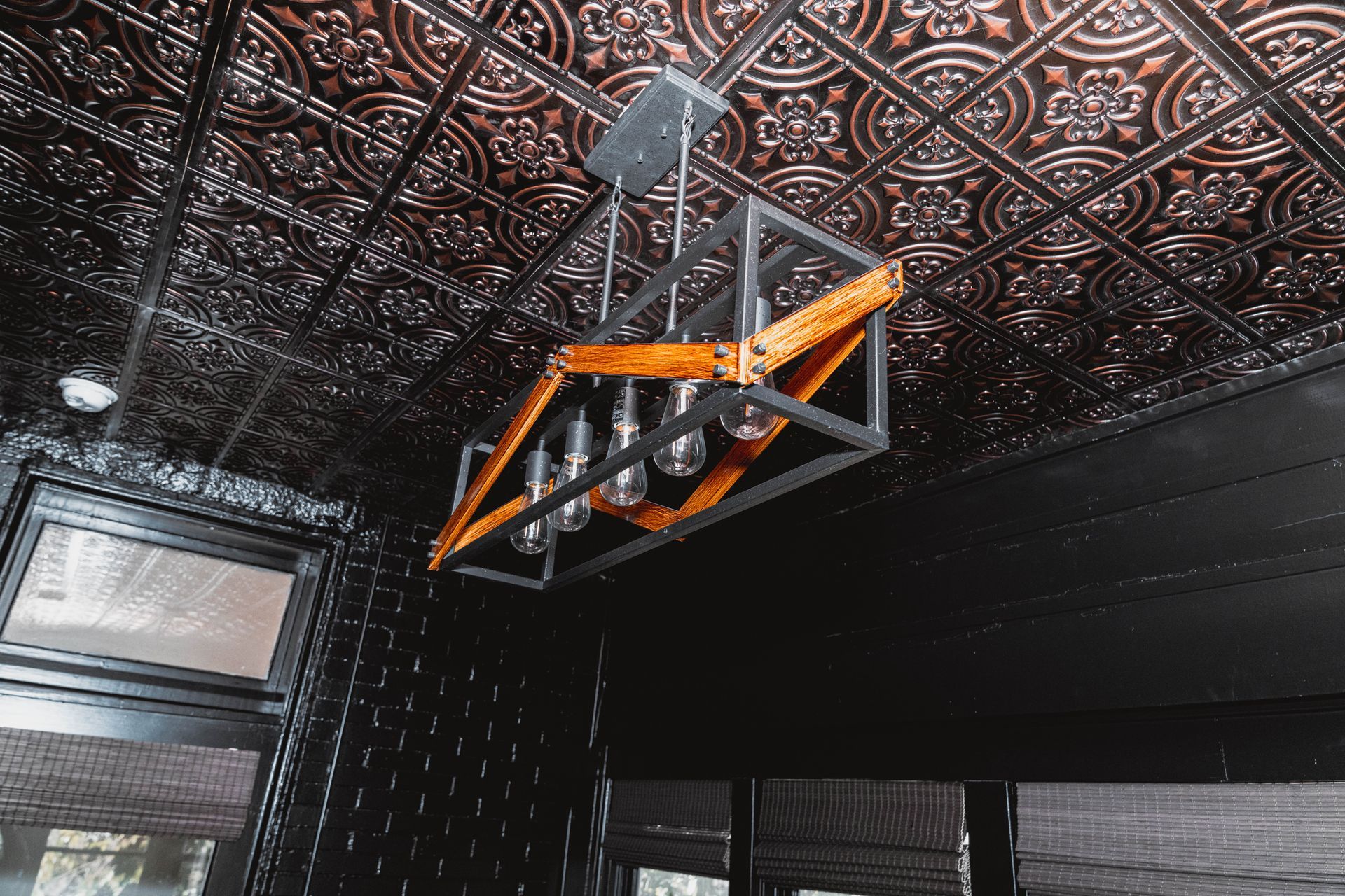 A chandelier is hanging from the ceiling of a room.