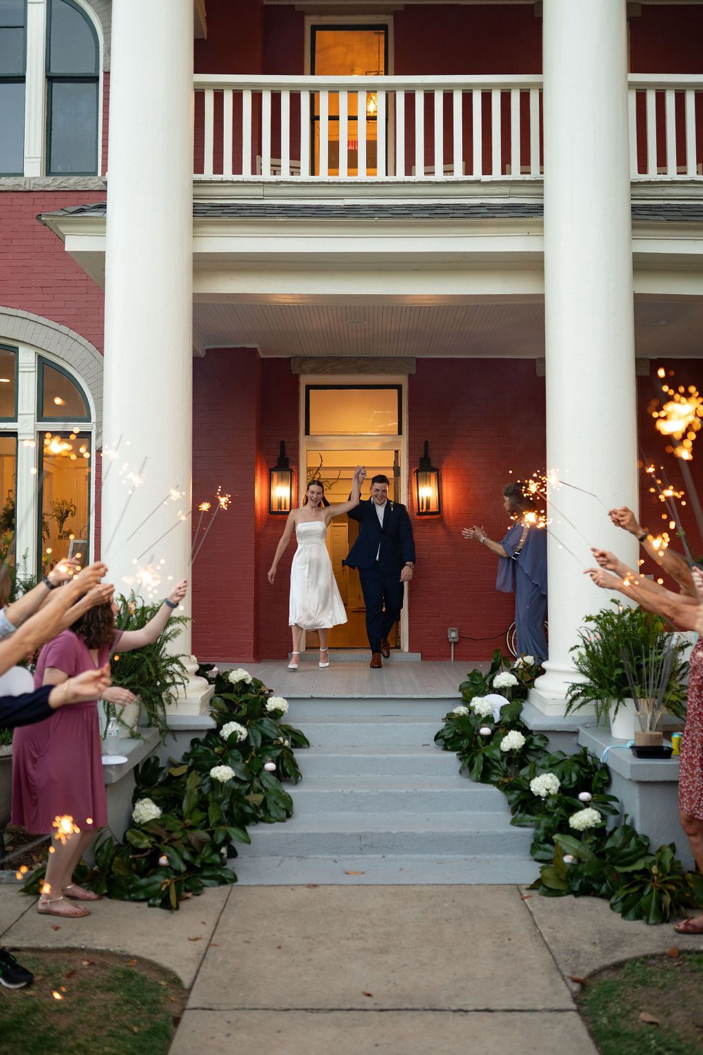 Married couple exiting the E.O. Manees House in historic Argenta