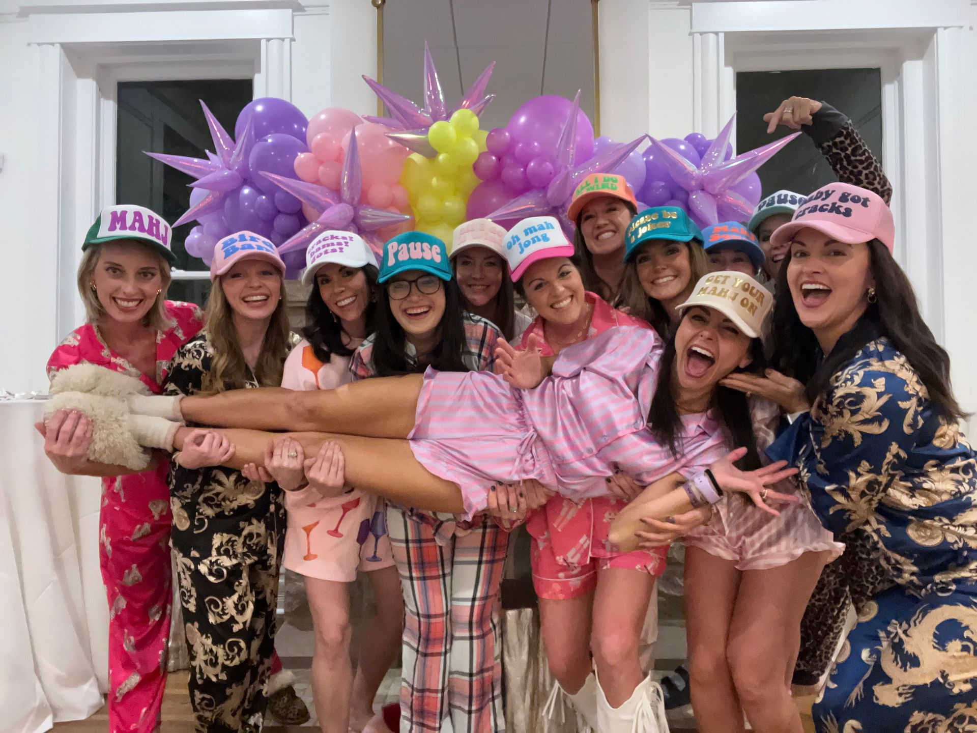 A group of women are posing for a picture at a bachelorette party. EO Manees House in North Little Rock, AR