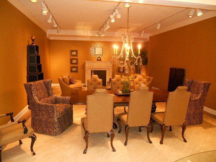 A yellow excavator is sitting on top of a pile of gravel.