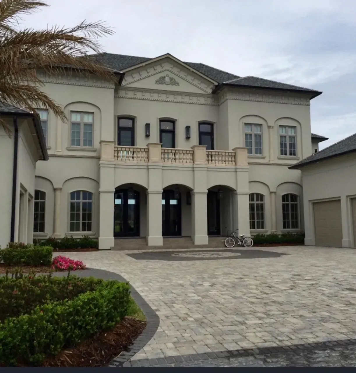 A man is working on a kitchen in a house under construction