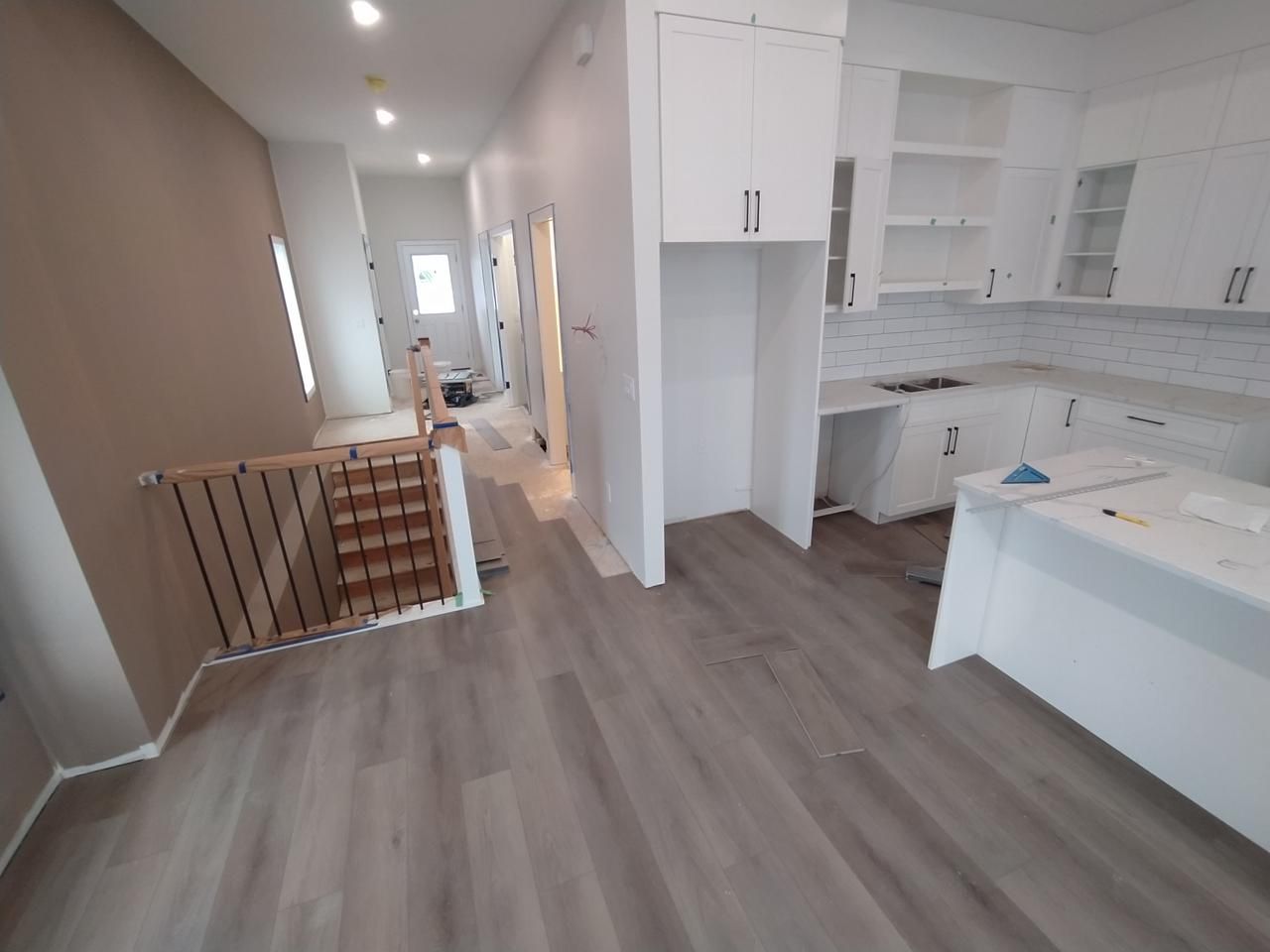 Modern home renovation with light wood-look luxury vinyl plank flooring in Sherwood Park by XMP Construction.