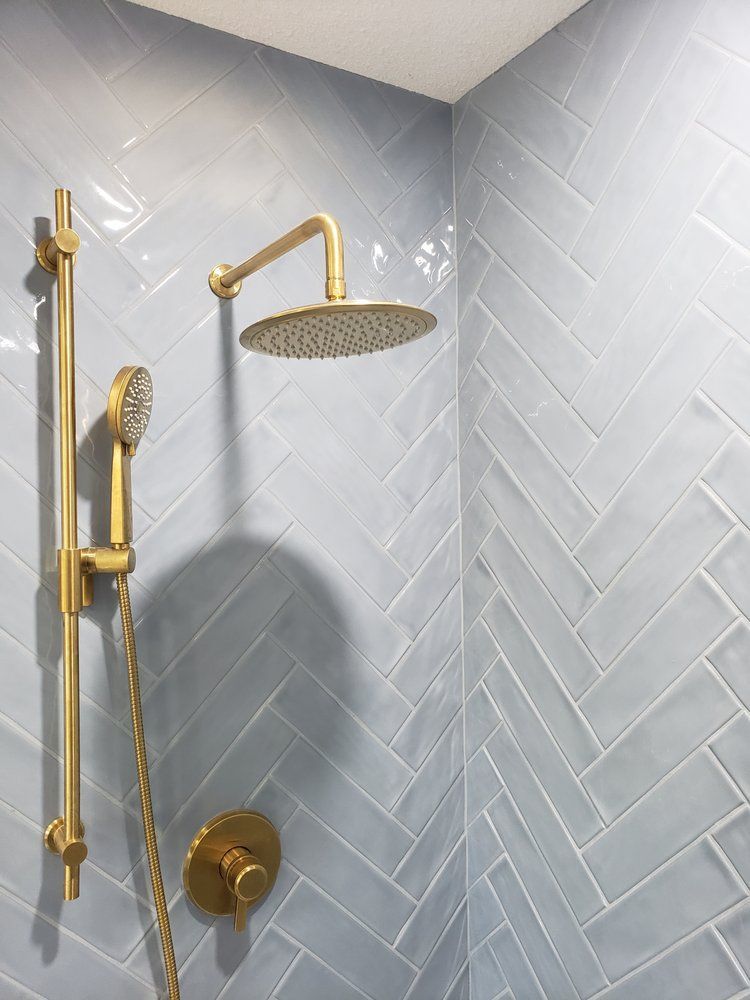 Mosaic tile shower wall installed by XMP Construction in Sherwood Park bathroom.