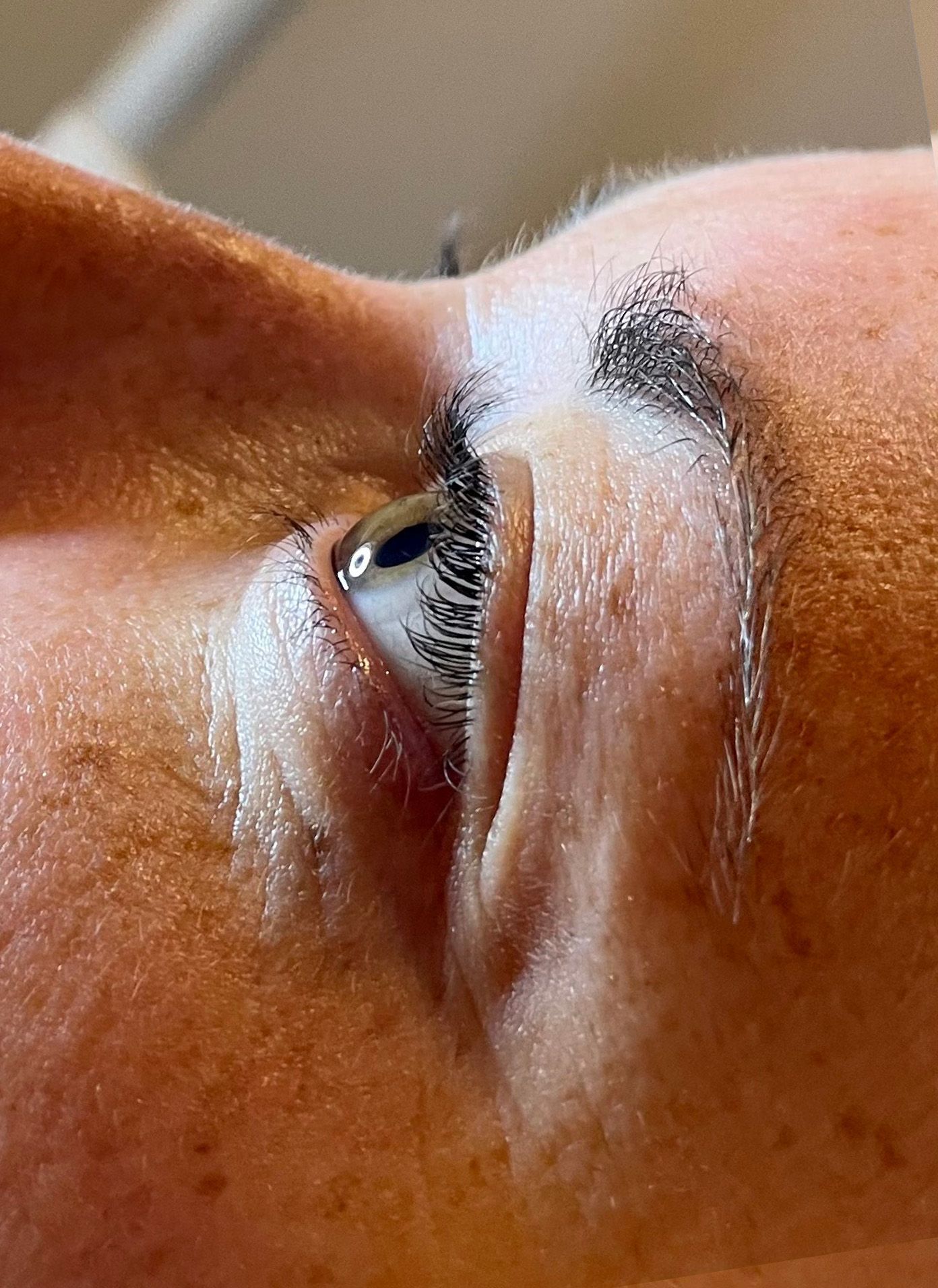 before & after a close up of a woman 's eye with long eyelashes