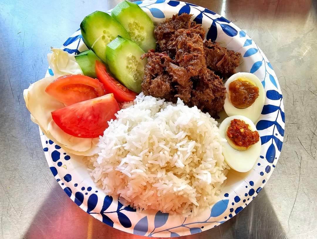 Spicy coconut beef with white rice and fresh veggies