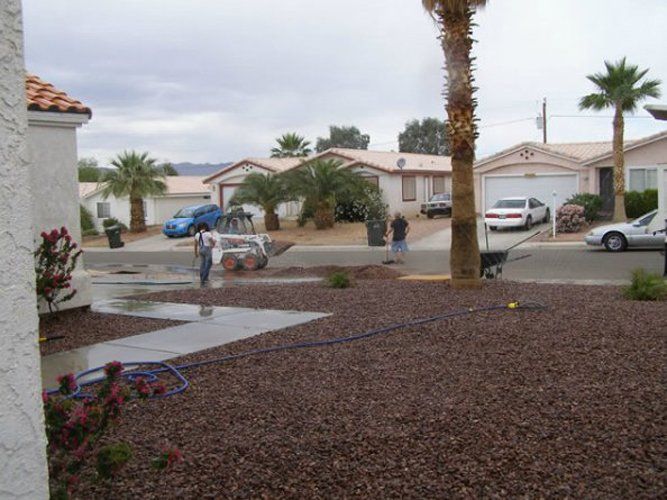 Woman Cleaning the Walk Path — Bullhead City, AZ — Rim Country's Rock N Yard