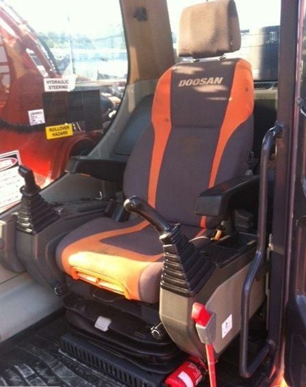 An orange and gray doosan seat in a vehicle