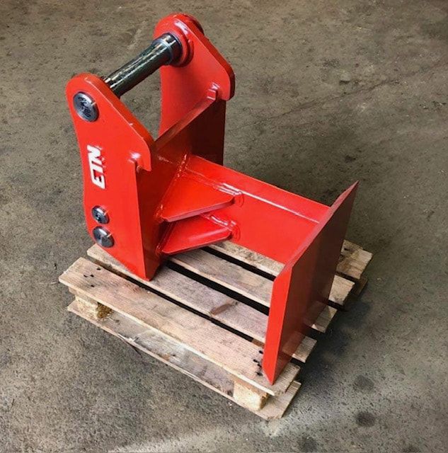 A red item with the word etn on it sits on a wooden pallet