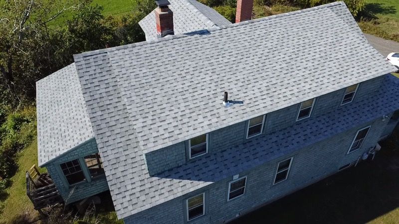 Completed roof replacement project showcasing quality work in Amherst Mass. Drone image.