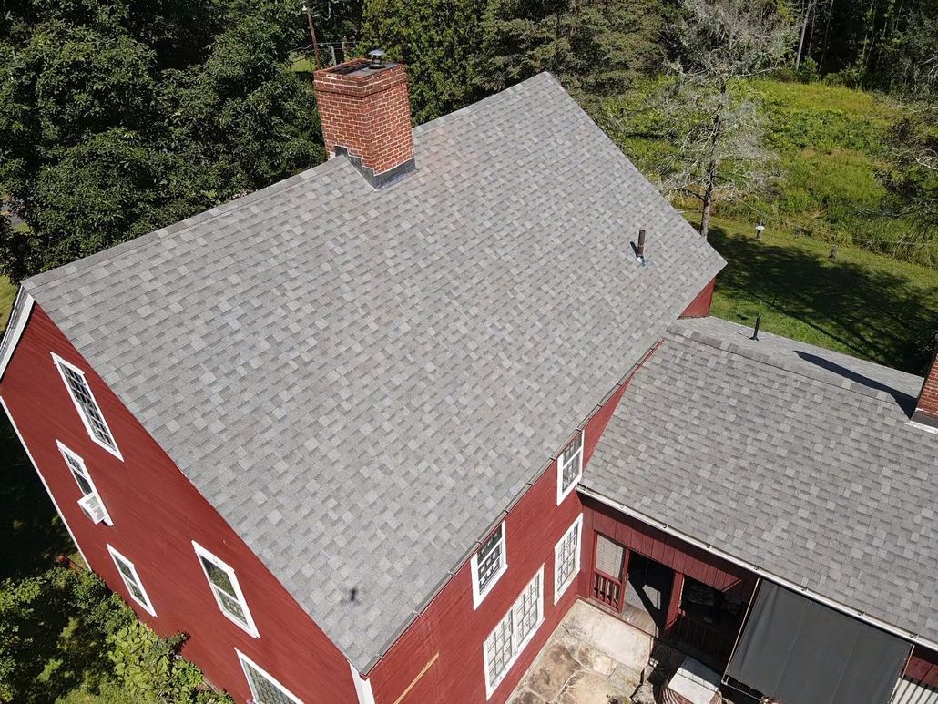 Red house grey roof. Roof replacement. Western Mass. Amherst