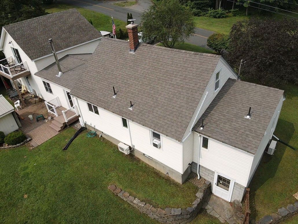 White house, brown roof. Roof replacement. Western Mass.