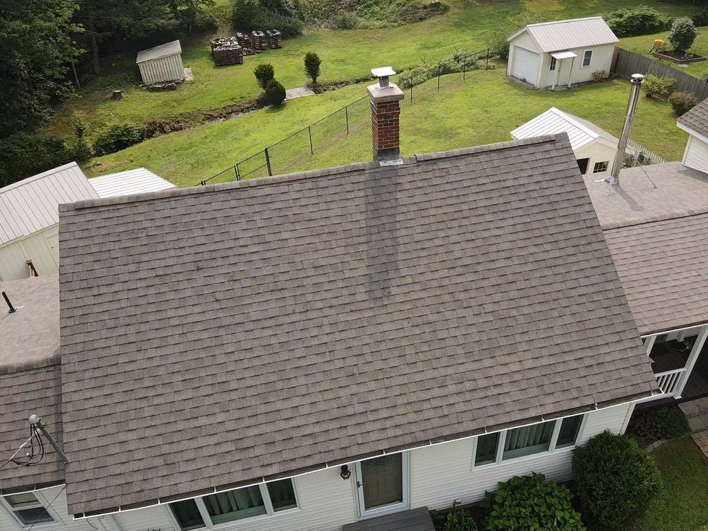 White house, brown roof. Roof replacement. Western Mass.