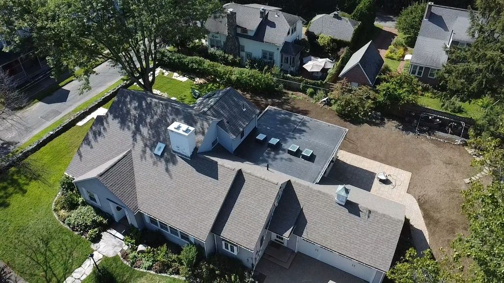 Roof replacement. Western mass. Northampton. Skylights. Flat Roof Shingle Roof.