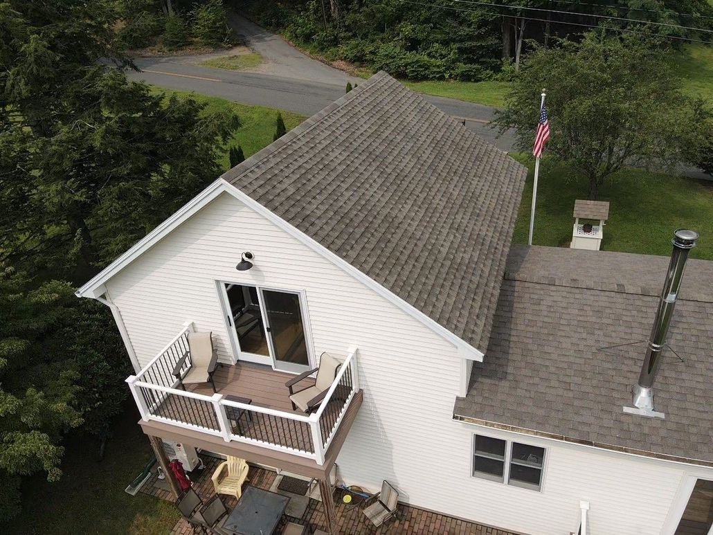 White house, brown roof. Roof replacement. Western Mass.