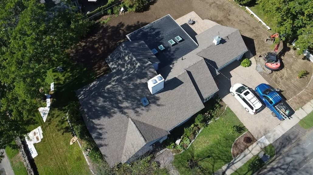 Roof replacement. Western mass. Northampton. Skylights. Flat Roof Shingle Roof.