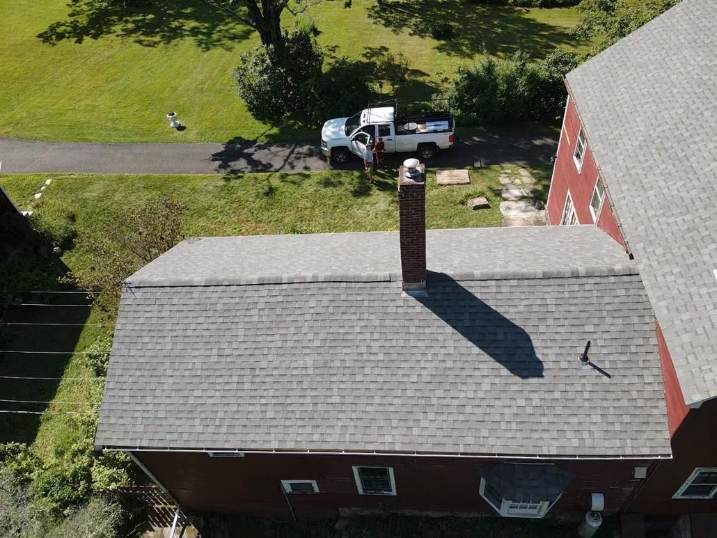 Red house grey roof. Roof replacement. Western Mass. Amherst