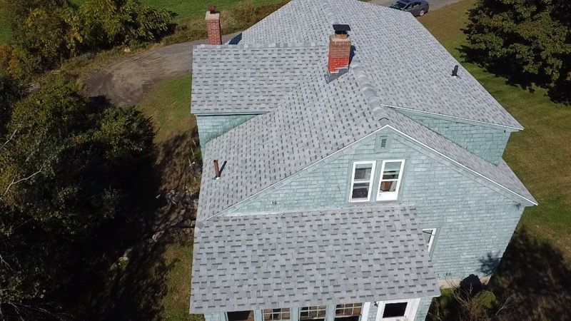 Completed roof replacement project showcasing quality work. Drone image. Amherst MA. 