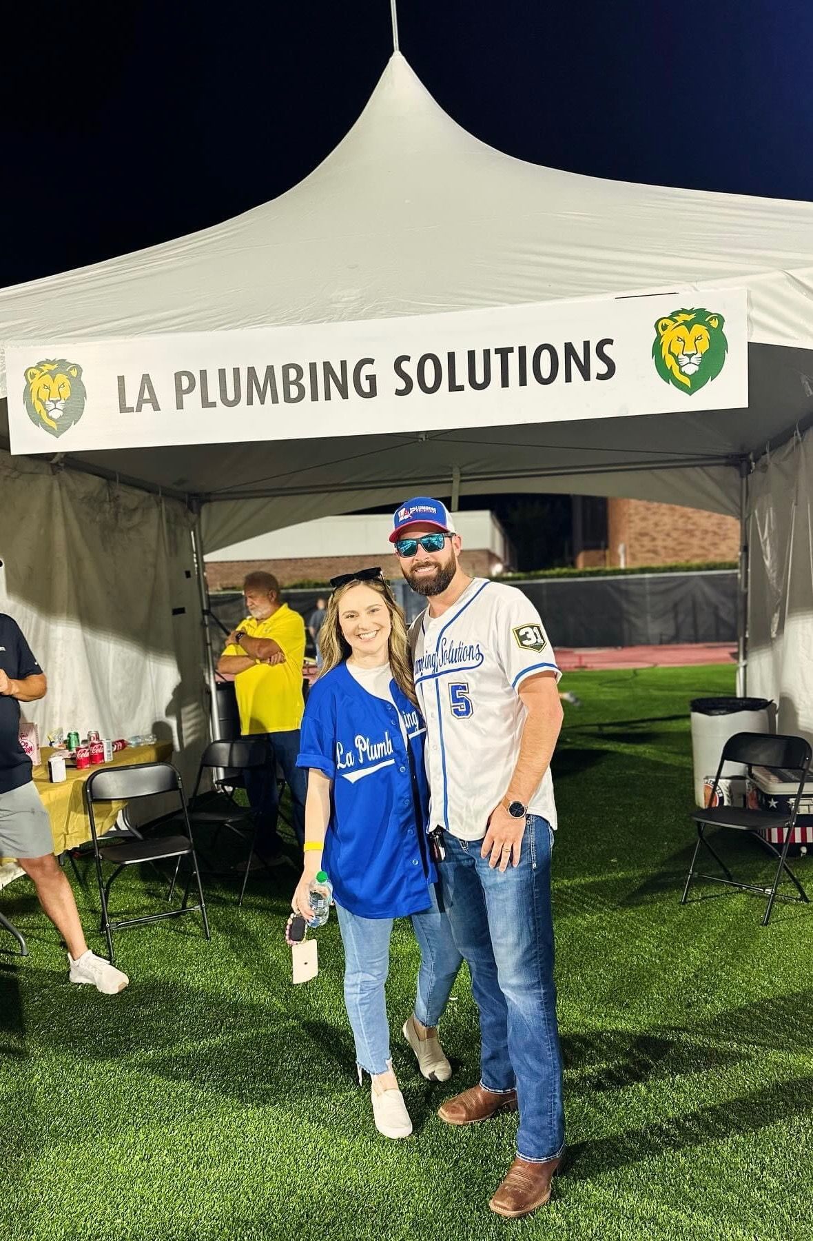 Couple standing under a tent with 