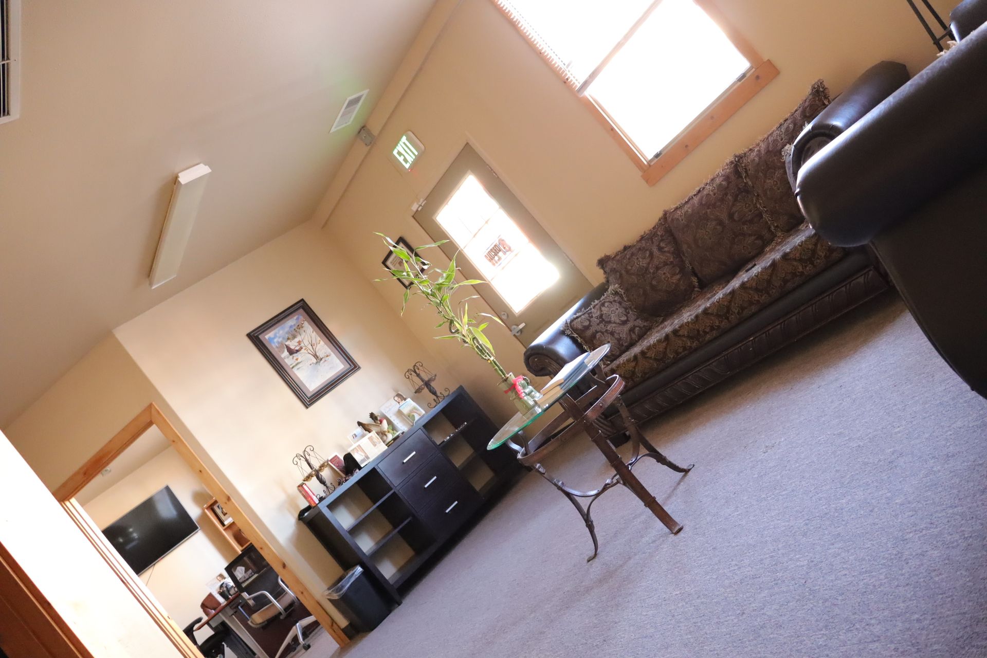 A living room with a couch and a table