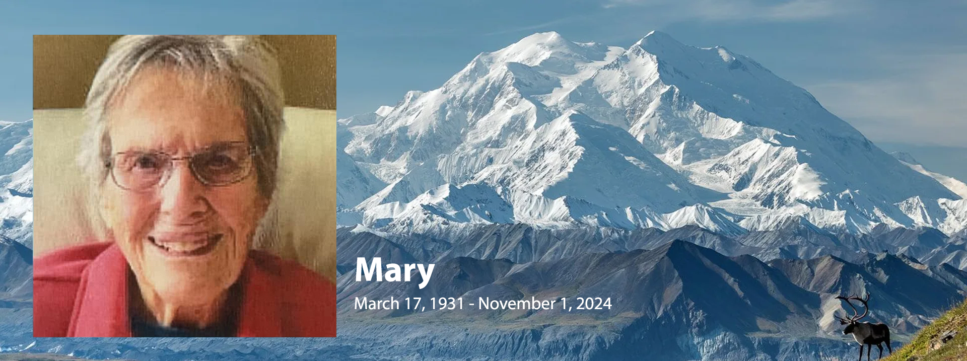 A picture of mary with a mountain in the background