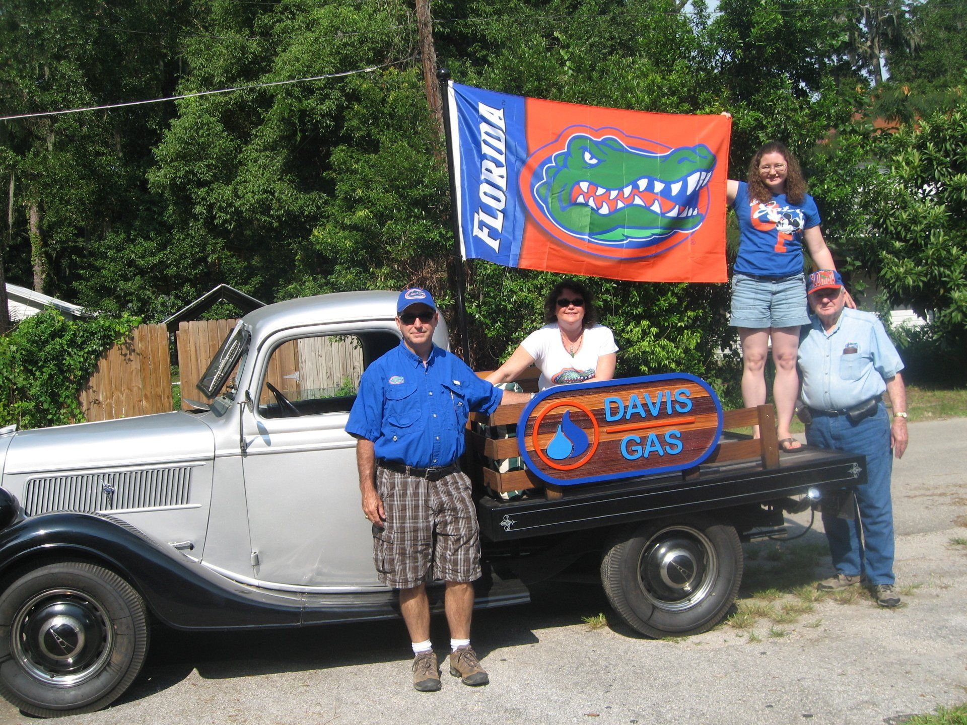 Four Staff Of Davis Gas Company With Florida Words On Banner - Gainesville, FL - Davis Gas Company Inc.