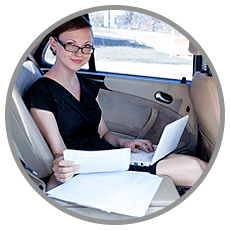 a lady using a laptop while travelling