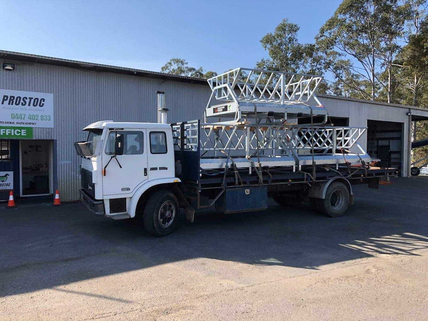 White Truck Loaded With Metal Frames Parked Outside — Prostoc In Wauchope, NSW