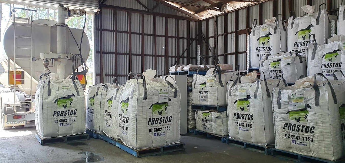 Large White Bags Labeled Prostoc Are Stacked Inside a Warehouse — Prostoc In Wauchope, NSW