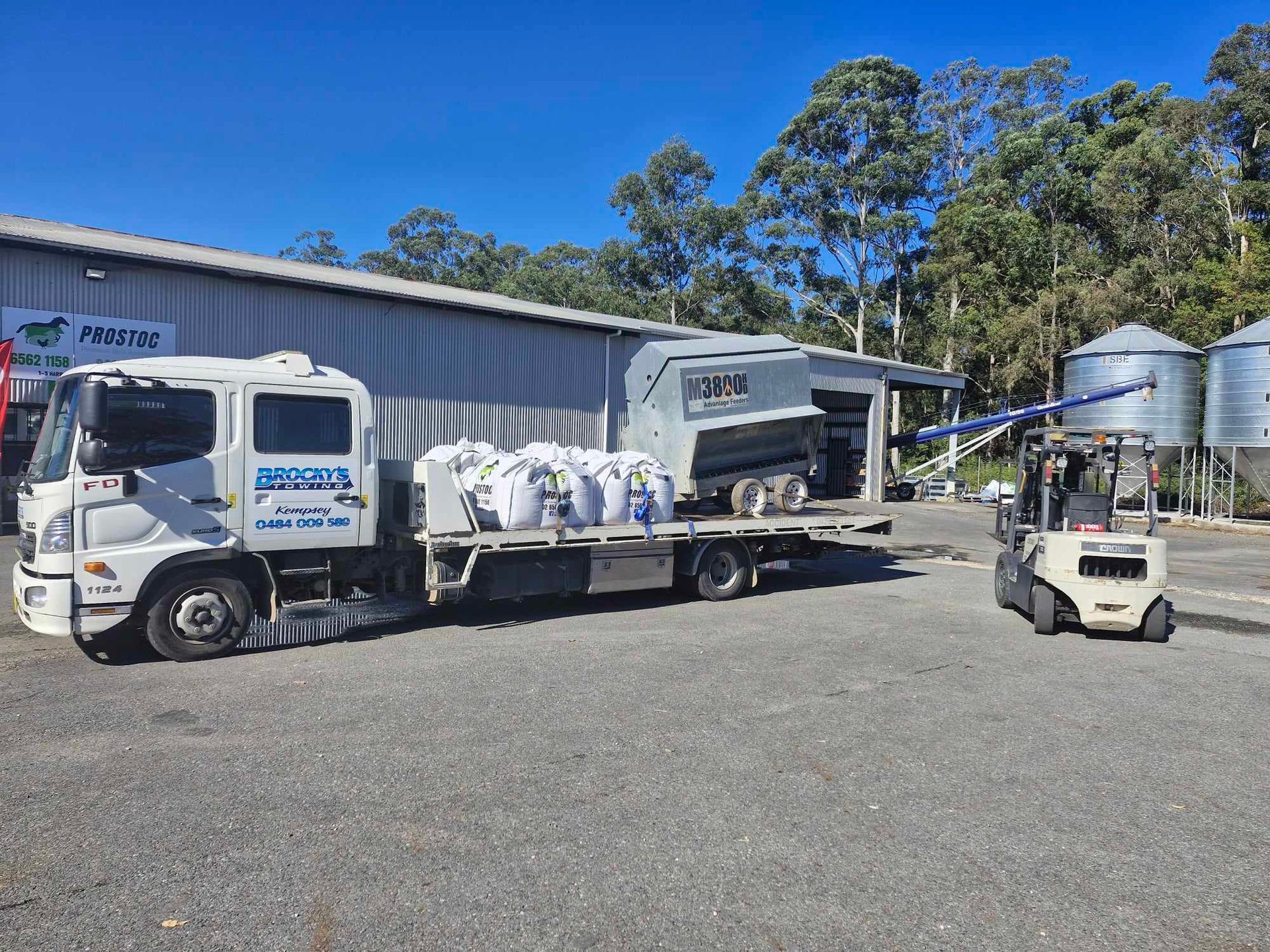 A White Truck Loaded With Bags and a Shed — Prostoc In Kempsey, NSW