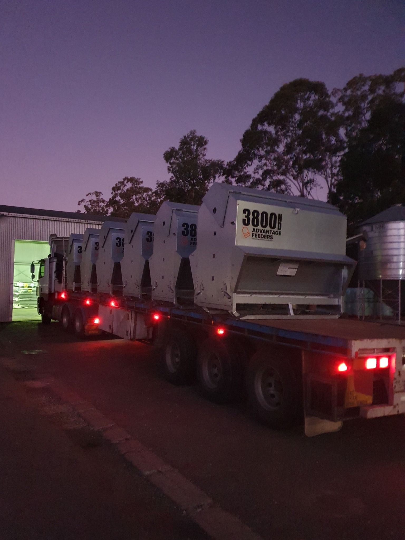A Flatbed Truck Carrying Multiple Industrial Machines — Prostoc In Willawarrin, NSW