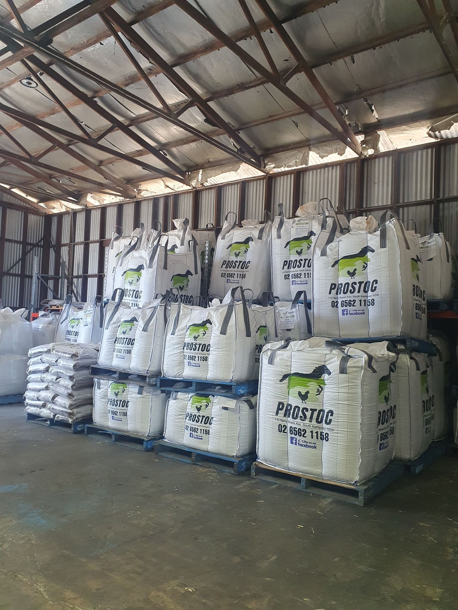 Large White Bags Stacked on Pallets Inside a Warehouse — Prostoc In Port Macquarie, NSW