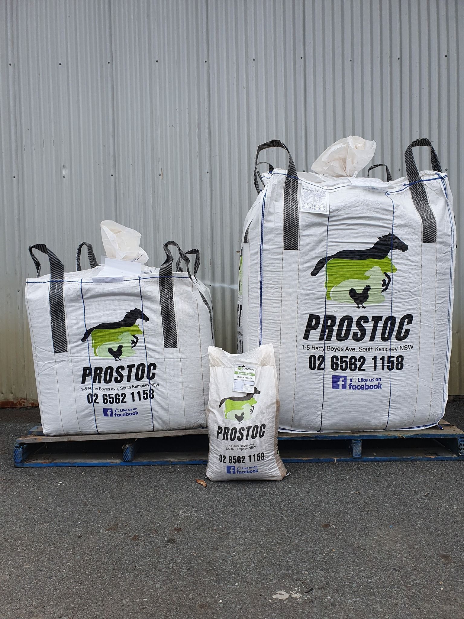 Three White Prostoc Bags of Different Sizes on a Pallet in Front of a Grey Wall — Prostoc In South Kempsey, NSW