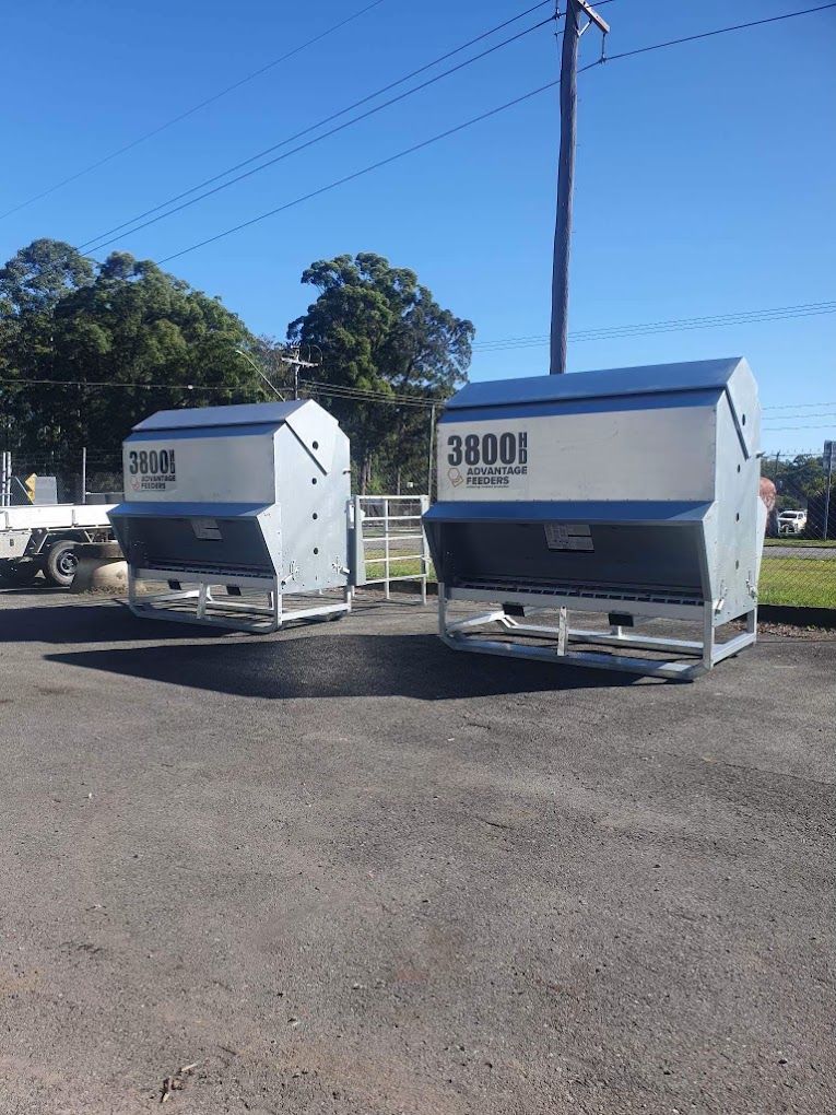 Two Large Blue and Silver Agricultural Machines Parked on Pavement — Prostoc In South Kempsey, NSW