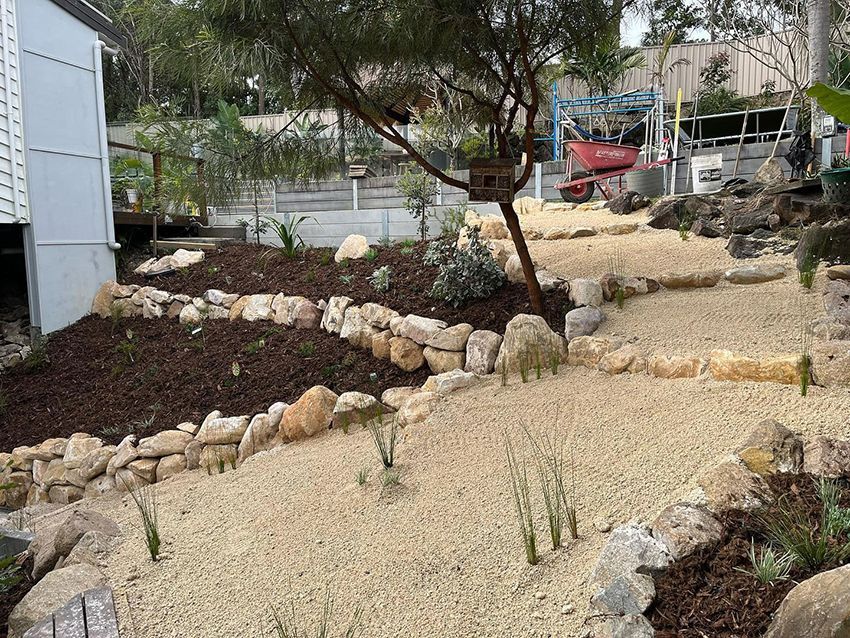 A Garden with a Lot of Rocks and Plants in It — HMJ Landscapes in Mudgeeraba, QLD