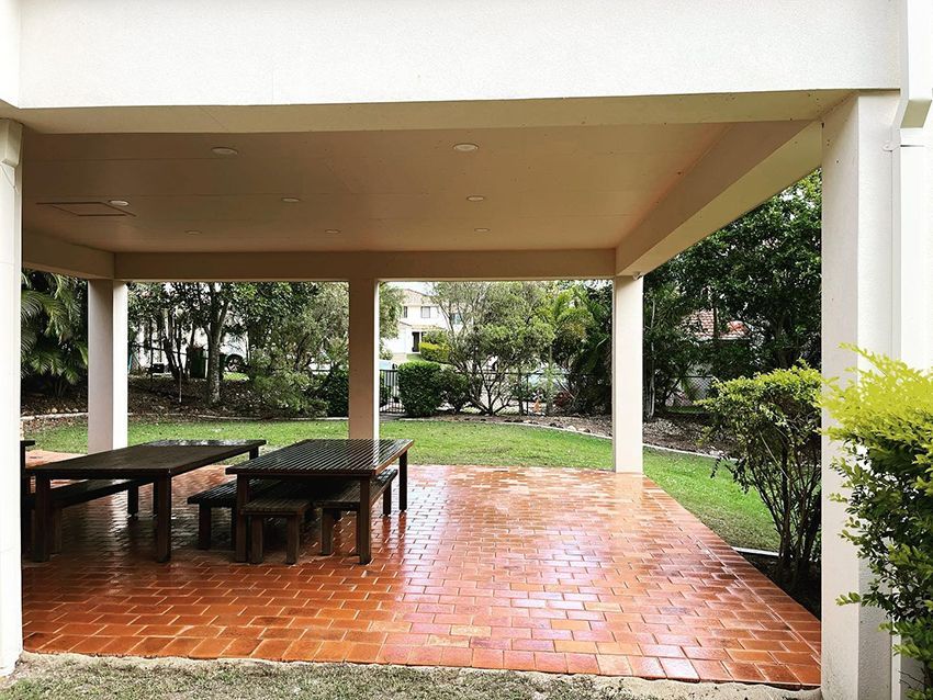 A Picnic Area with Tables and Benches Under a Canopy in a Park — HMJ Landscapes in Tweed Heads, NSW