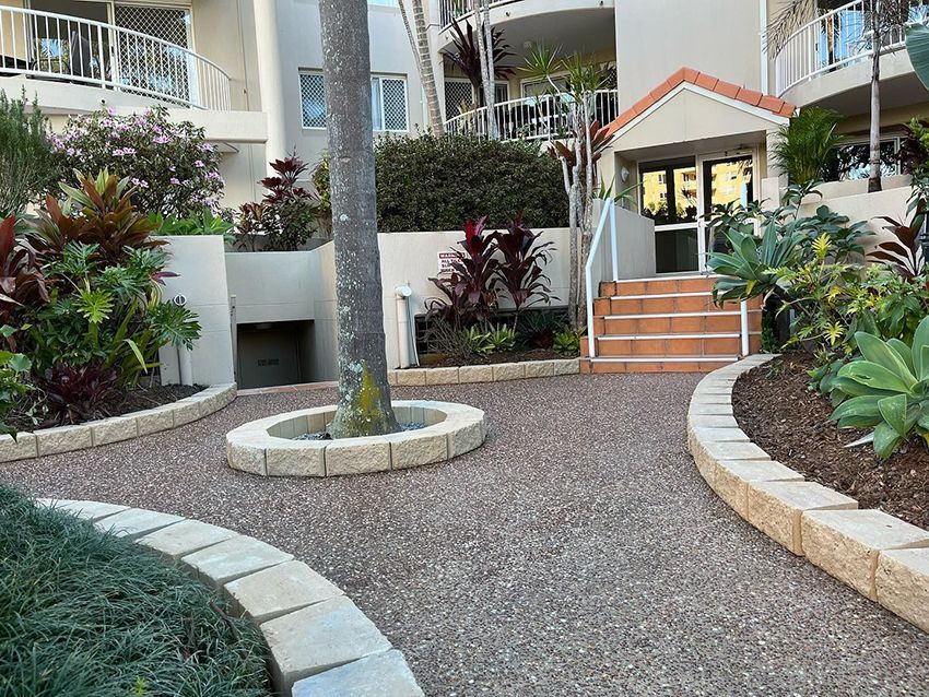 A Building with Stairs and a Tree in Front of It — HMJ Landscapes in Burleigh Heads, QLD