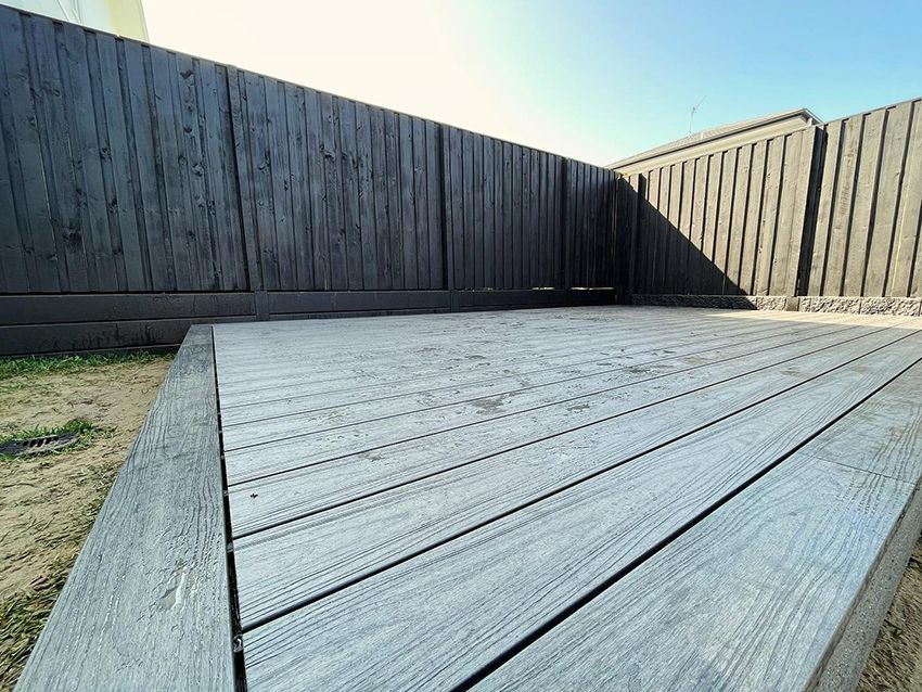 A Wooden Deck with a Black Fence — HMJ Landscapes in Broadbeach, QLD