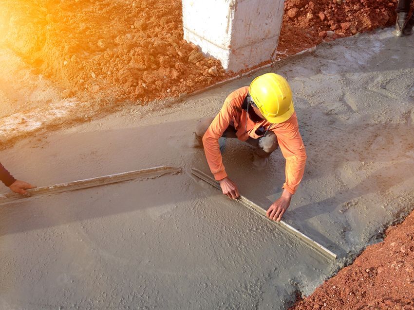 A Construction Worker is Measuring the Concrete with a Ruler — HMJ Landscapes in Hope Island, QLD