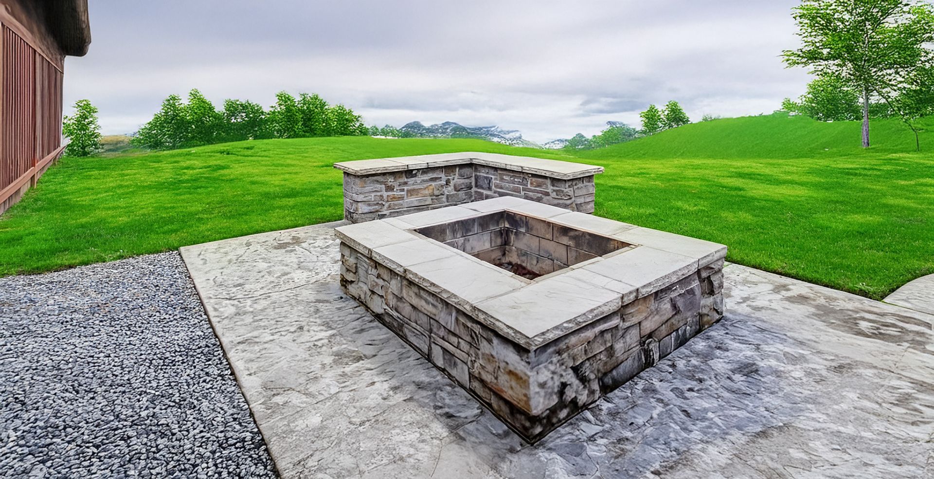 A Fire Pit is Sitting in the Middle of a Lush Green Field — HMJ Landscapes in Broadbeach, QLD