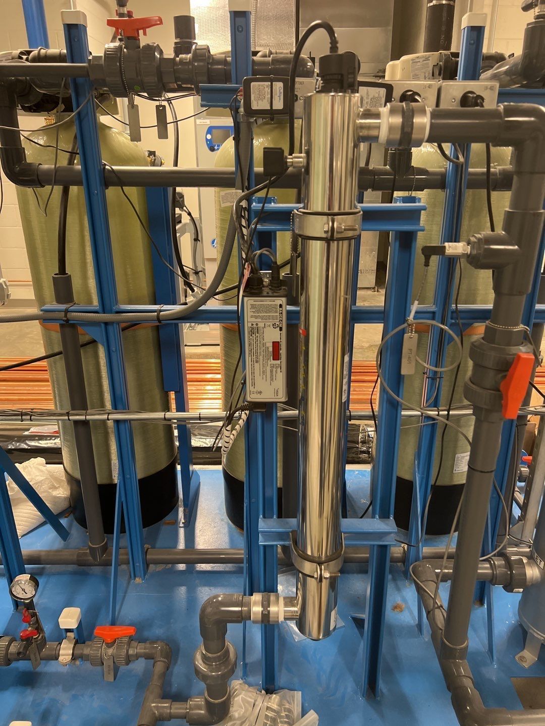 A bunch of pipes are connected to each other in a room