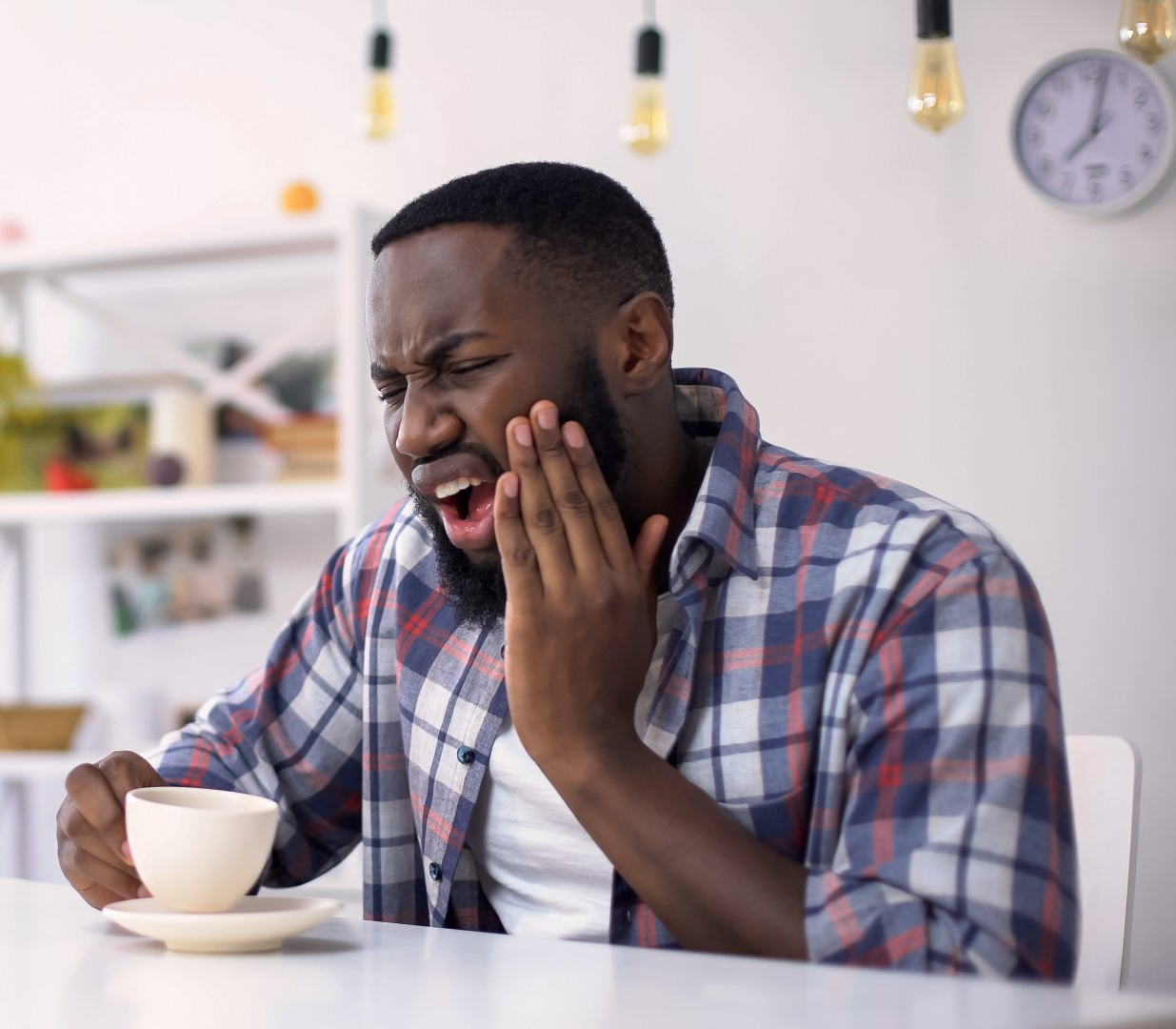 man experiencing tooth pain
