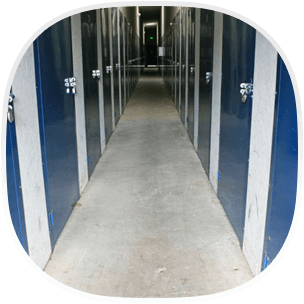 A corridor lined with blue steel doors