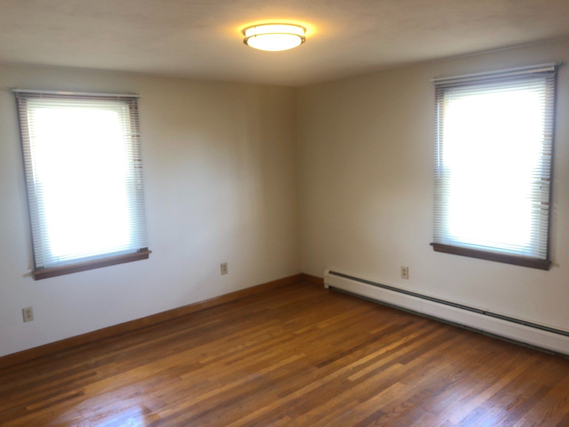 Apartment C room with two windows — Vernon, CT — A1 Properties
