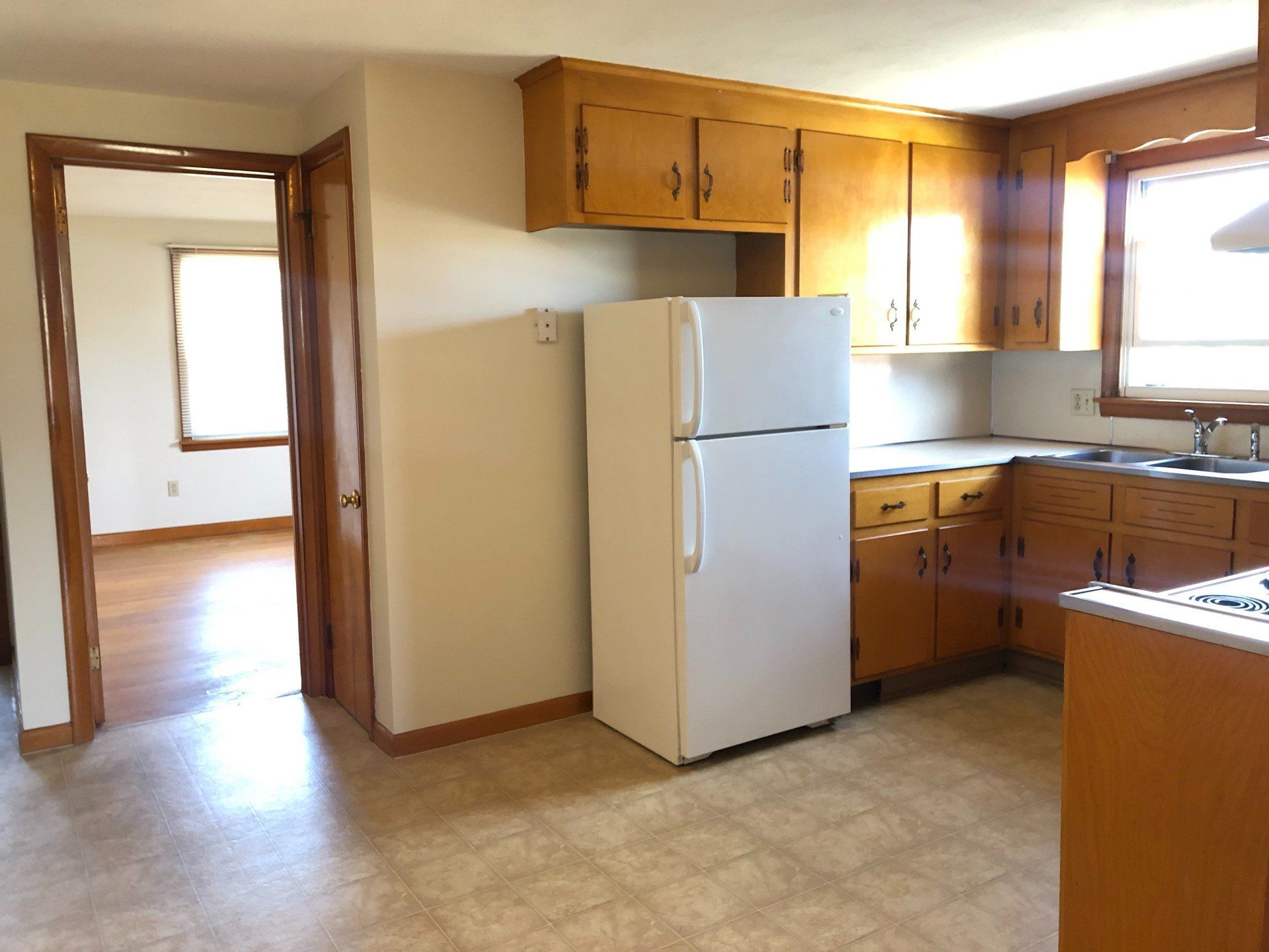 Apartment C kitchen with white refrigerator — Vernon, CT — A1 Properties