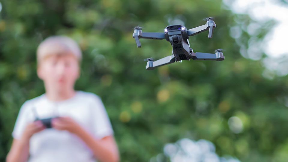 Kid playing with drone