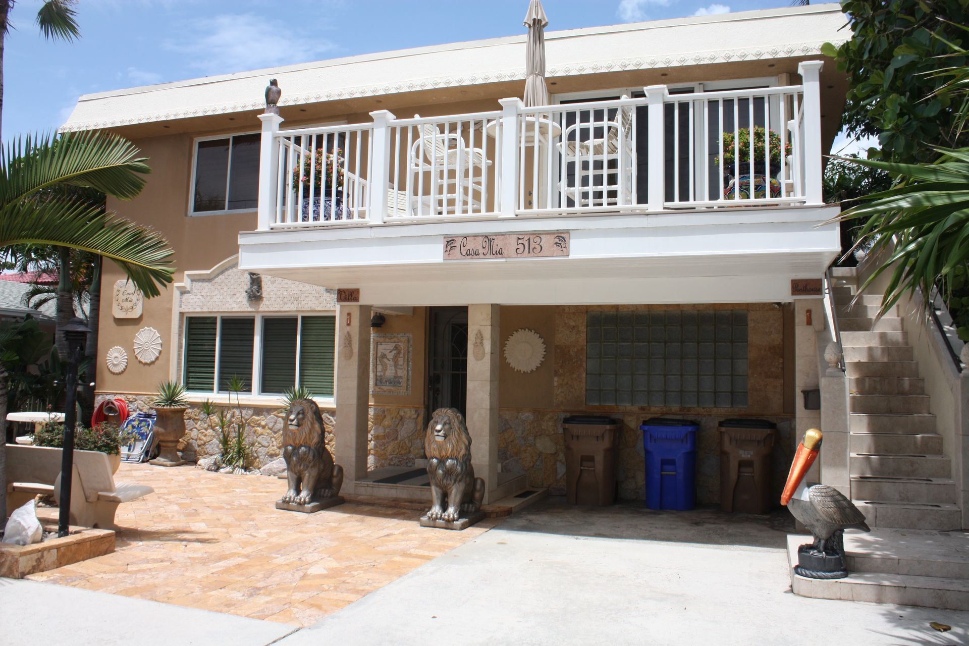 A large house with a balcony and stairs