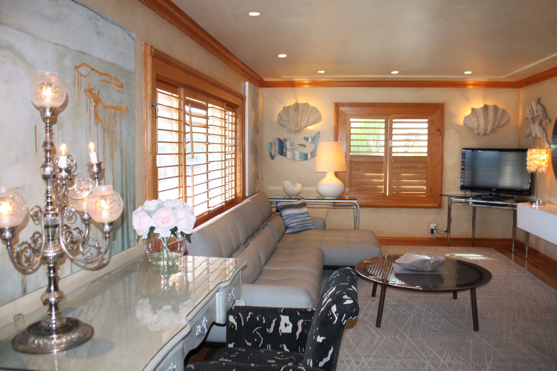 A living room with a couch and a television